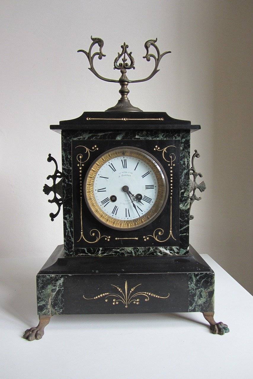 french mantel clock with black marble design